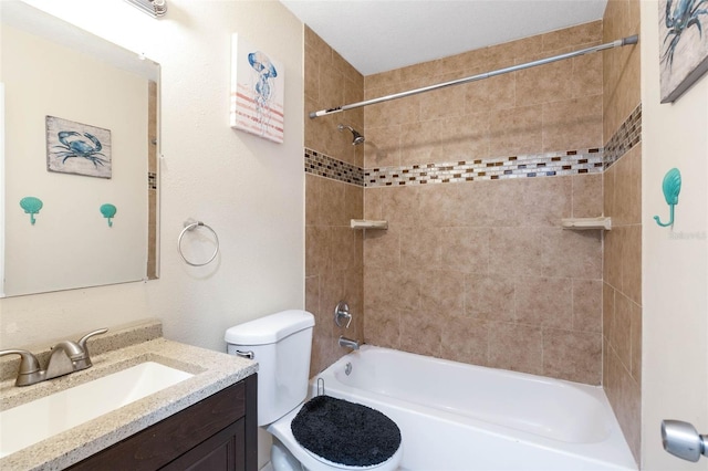 full bath featuring toilet, vanity, and bathing tub / shower combination