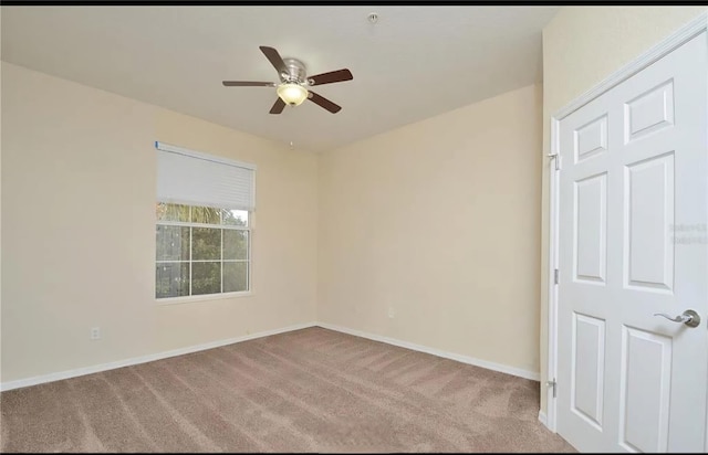 1357 Venezia Ct Unit 202, Davenport, FL 33896 - spare room with a ceiling fan, carpet floors, and baseboards