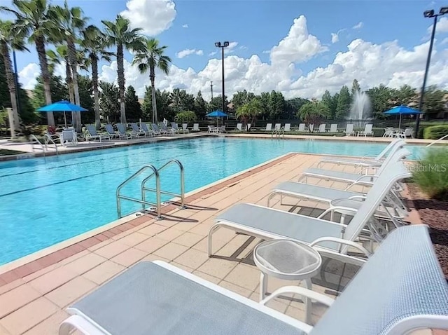 1357 Venezia Ct Unit 202, Davenport, FL 33896 - community pool featuring a patio area
