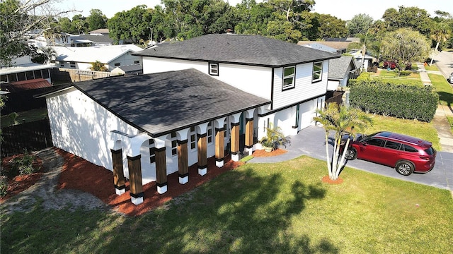 birds eye view of property with a residential view