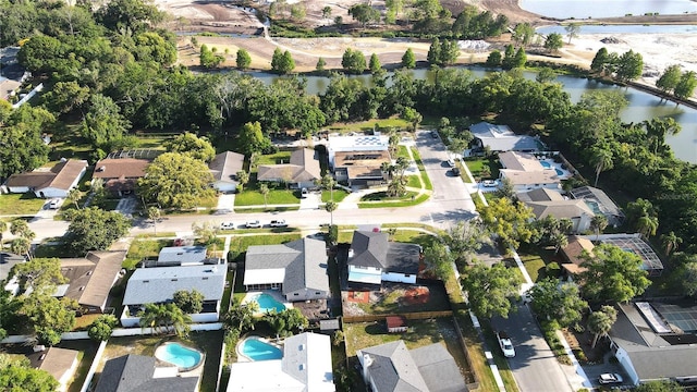 drone / aerial view with a residential view and a water view
