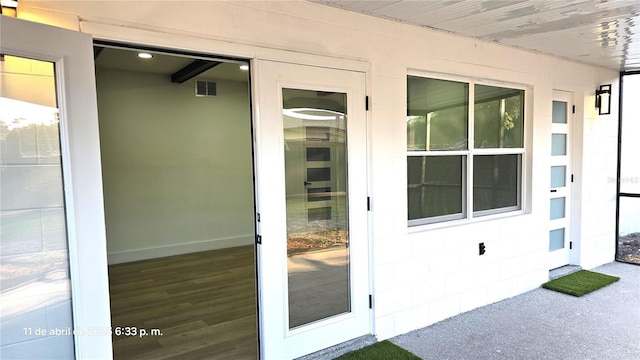 entrance to property featuring visible vents