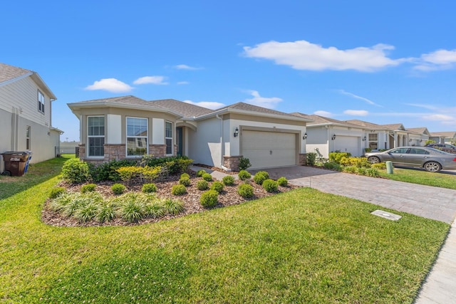 2019 Spring Shower Cir, Kissimmee, FL 34744 - view of front facade featuring driveway, stone siding, an attached garage, a front yard, and stucco siding