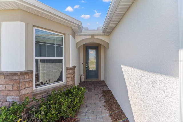 2019 Spring Shower Cir, Kissimmee, FL 34744 - property entrance with stucco siding and stone siding