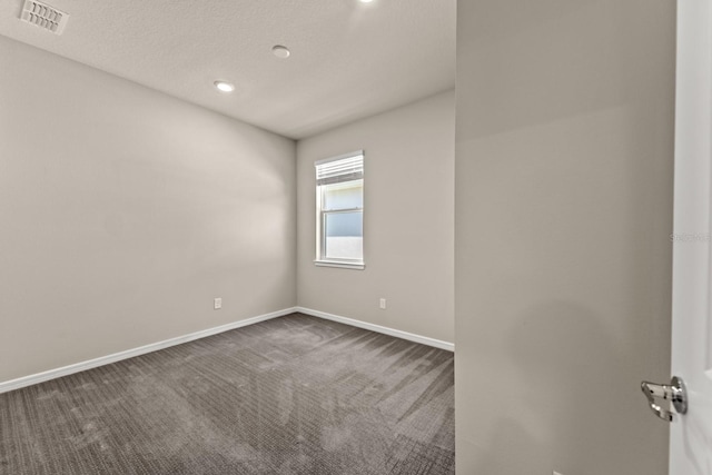 2019 Spring Shower Cir, Kissimmee, FL 34744 - empty room featuring baseboards, visible vents, dark carpet, and recessed lighting