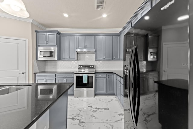 2019 Spring Shower Cir, Kissimmee, FL 34744 - kitchen featuring visible vents, appliances with stainless steel finishes, gray cabinets, under cabinet range hood, and ornamental molding