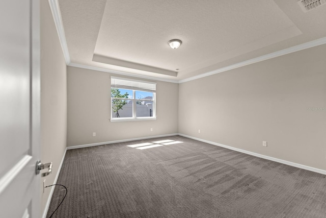 2019 Spring Shower Cir, Kissimmee, FL 34744 - spare room featuring crown molding, a raised ceiling, baseboards, dark colored carpet, and visible vents