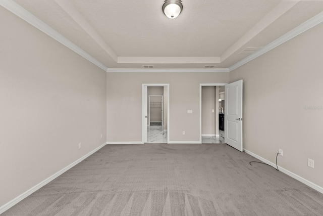 2019 Spring Shower Cir, Kissimmee, FL 34744 - carpeted spare room featuring a raised ceiling, visible vents, baseboards, and ornamental molding