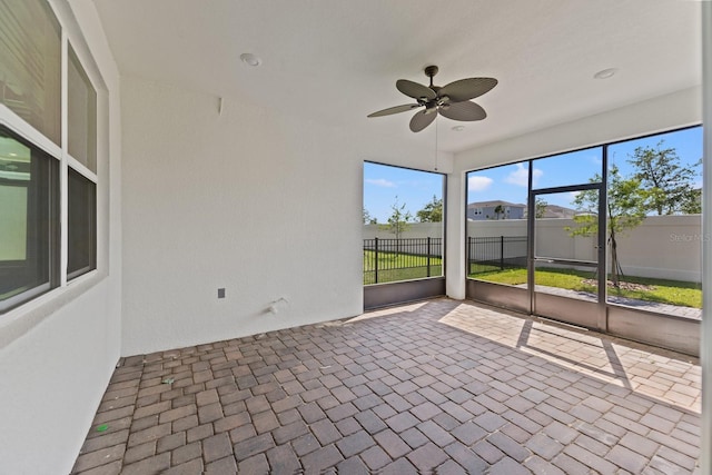 2019 Spring Shower Cir, Kissimmee, FL 34744 - unfurnished sunroom featuring ceiling fan