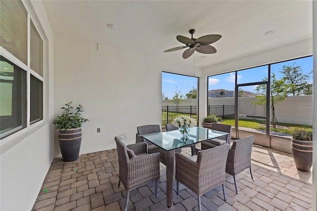 2019 Spring Shower Cir, Kissimmee, FL 34744 - sunroom / solarium with ceiling fan and outdoor dining space