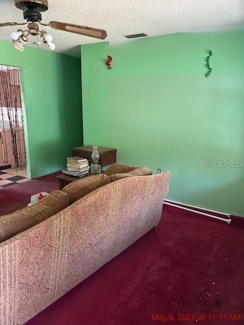 2117 Lemon St, Haines City, FL 33844 - living room with a ceiling fan and a textured ceiling