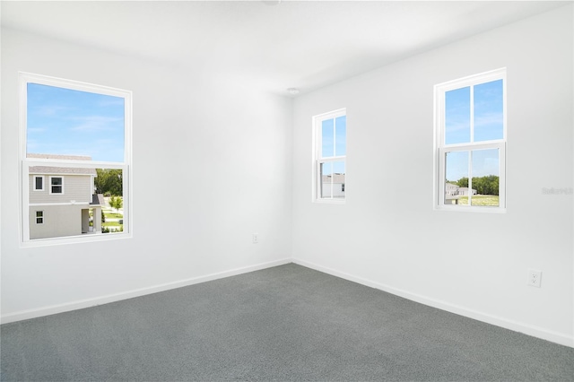 824 Lake Dell Rd, Dundee, FL 33838 - spare room featuring healthy amount of natural light, baseboards, and carpet