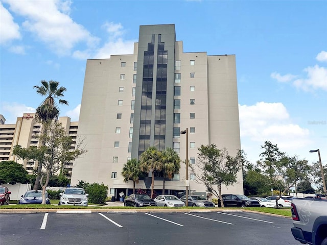 6165 Carrier Dr Unit 1603, Orlando, FL 32819 - view of apartment building / complex with uncovered parking