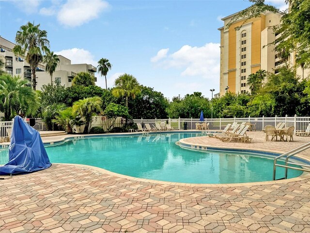 6165 Carrier Dr Unit 1603, Orlando, FL 32819 - community pool with a patio area