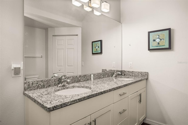 bathroom featuring double vanity and a sink