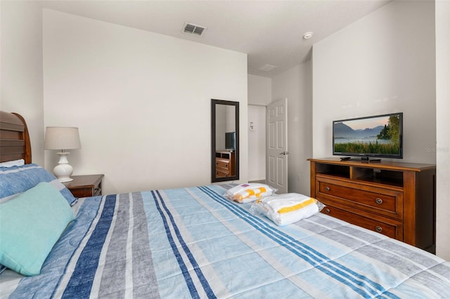 bedroom featuring visible vents