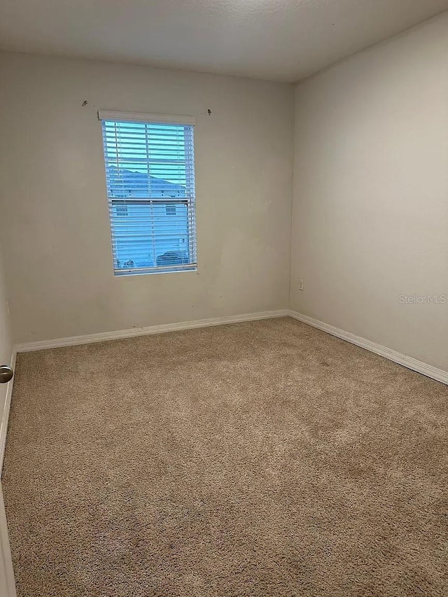 167 Eagleview Loop, Davenport, FL 33837 - empty room with carpet and baseboards