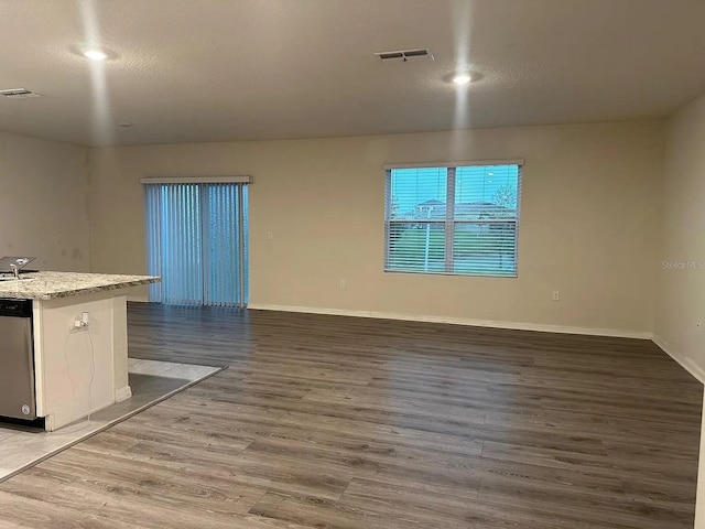 167 Eagleview Loop, Davenport, FL 33837 - empty room with light wood-style floors, baseboards, and a textured ceiling