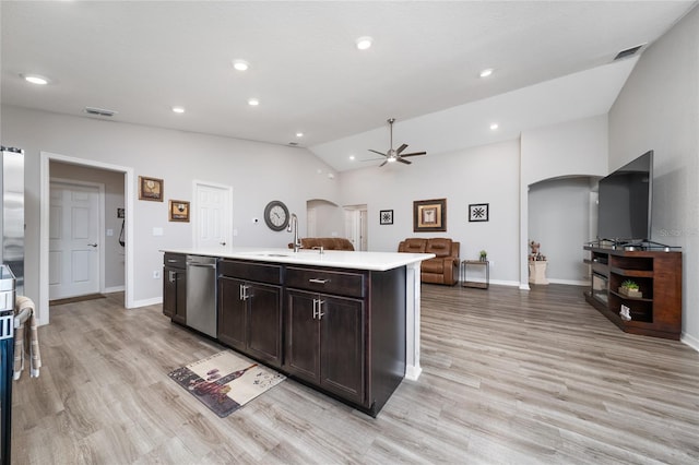 2059 Dexter St, Haines City, FL 33844 - kitchen featuring stainless steel dishwasher, a ceiling fan, a sink, arched walkways, and light countertops