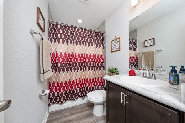 2059 Dexter St, Haines City, FL 33844 - bathroom featuring curtained shower, wood finished floors, toilet, and vanity