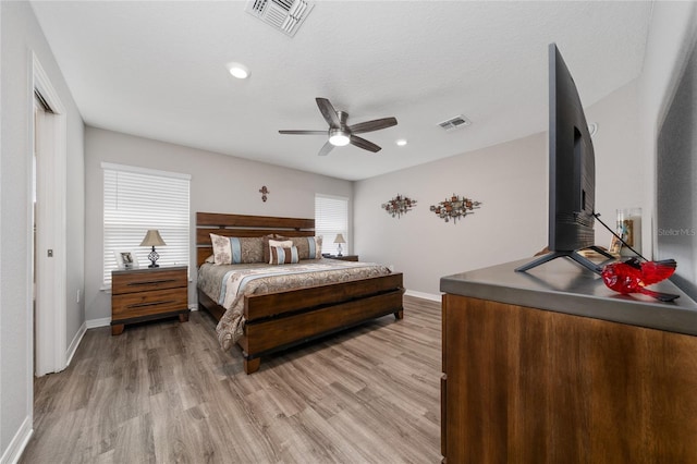 2059 Dexter St, Haines City, FL 33844 - bedroom with baseboards, light wood-style floors, and visible vents