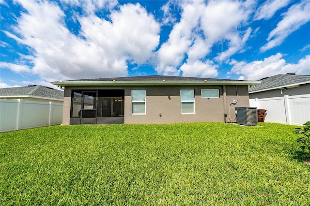 2059 Dexter St, Haines City, FL 33844 - back of house featuring stucco siding, a sunroom, and a fenced backyard