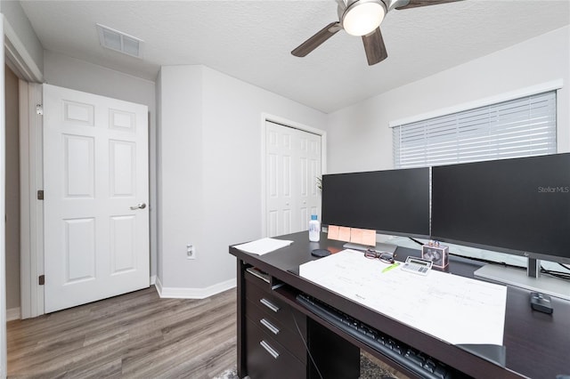 2059 Dexter St, Haines City, FL 33844 - office area with baseboards, visible vents, a ceiling fan, and light wood-style floors