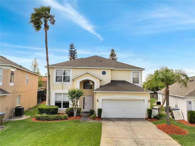 997 Lake Berkley Dr, Kissimmee, FL 34746 - traditional home with concrete driveway, an attached garage, stucco siding, roof with shingles, and a front yard