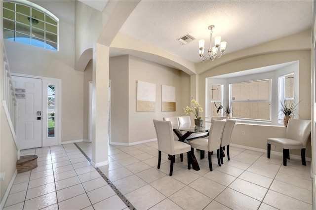 997 Lake Berkley Dr, Kissimmee, FL 34746 - dining space featuring a notable chandelier, a healthy amount of sunlight, visible vents, and light tile patterned floors