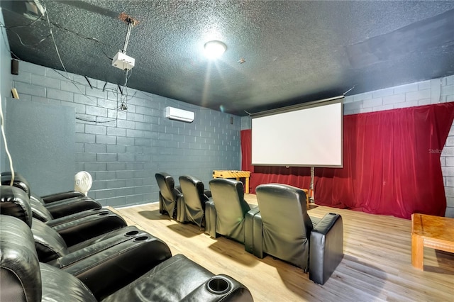 997 Lake Berkley Dr, Kissimmee, FL 34746 - cinema room featuring concrete block wall, wood finished floors, a textured ceiling, and an AC wall unit