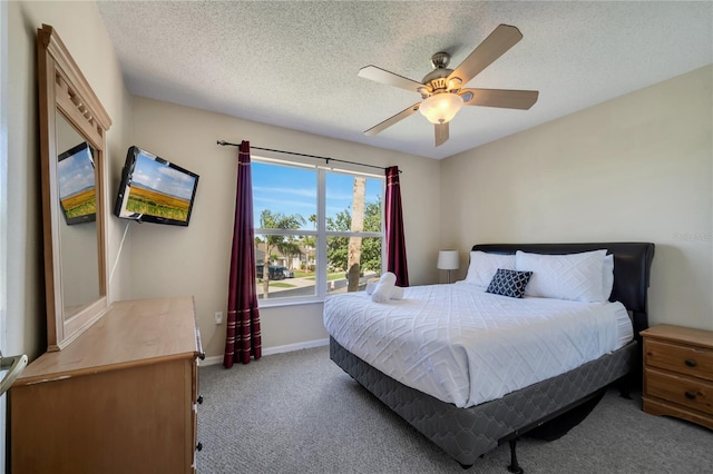 997 Lake Berkley Dr, Kissimmee, FL 34746 - bedroom featuring carpet, a textured ceiling, a ceiling fan, and baseboards