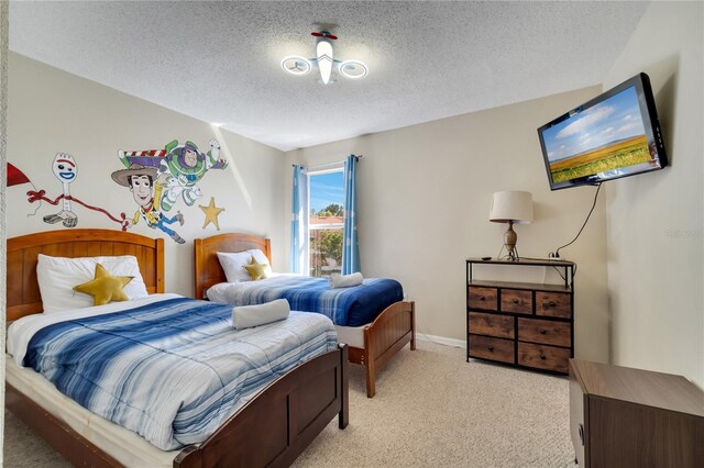 997 Lake Berkley Dr, Kissimmee, FL 34746 - bedroom featuring light colored carpet, baseboards, and a textured ceiling