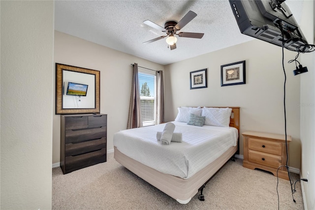 997 Lake Berkley Dr, Kissimmee, FL 34746 - bedroom featuring ceiling fan, light carpet, a textured ceiling, and baseboards