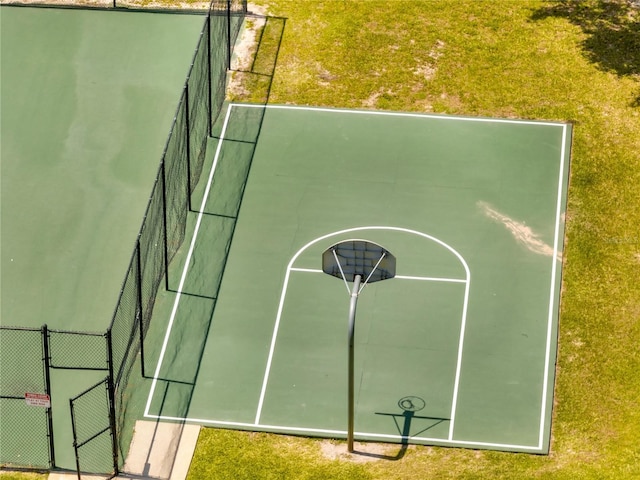 997 Lake Berkley Dr, Kissimmee, FL 34746 - view of sport court with fence, a lawn, and a tennis court