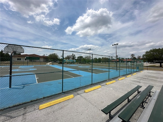 view of basketball court with fence and community basketball court