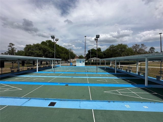 view of property's community featuring shuffleboard