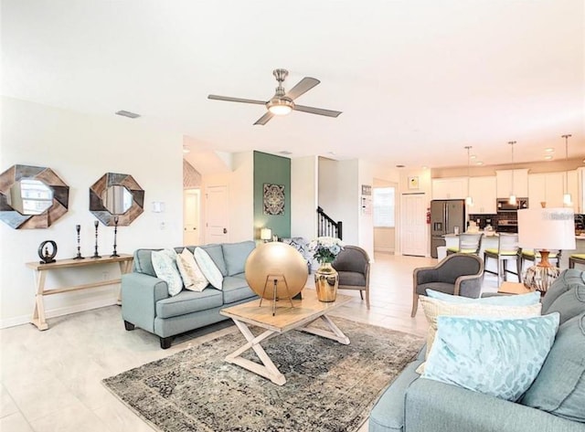 345 Ocean Course Ave, Davenport, FL 33896 - living room with baseboards, stairs, and ceiling fan