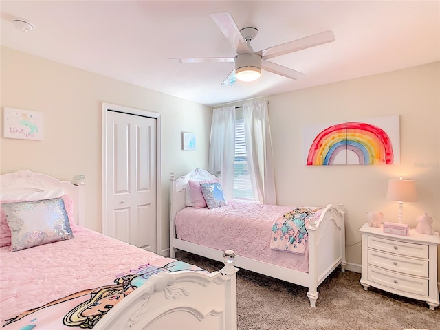 345 Ocean Course Ave, Davenport, FL 33896 - bedroom with baseboards, a ceiling fan, and light colored carpet