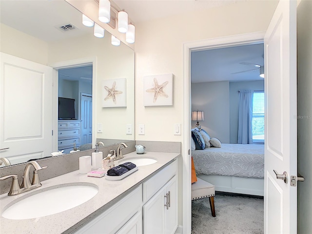 345 Ocean Course Ave, Davenport, FL 33896 - full bath featuring ensuite bathroom, visible vents, a sink, and double vanity