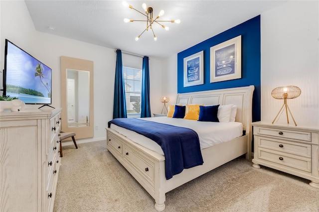 bedroom with light carpet and an inviting chandelier