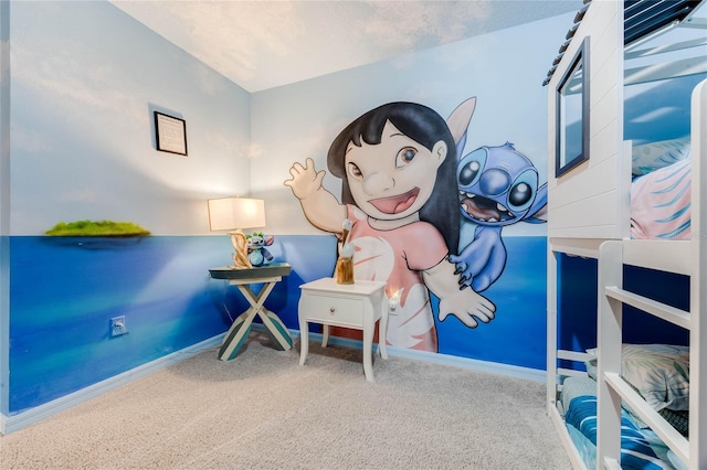 bedroom with carpet floors and baseboards
