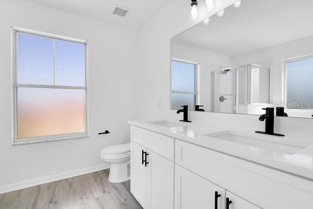 227 Sand Ridge Dr, Davenport, FL 33896 - full bath featuring a shower stall, toilet, a sink, and visible vents