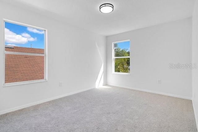 227 Sand Ridge Dr, Davenport, FL 33896 - carpeted spare room featuring baseboards