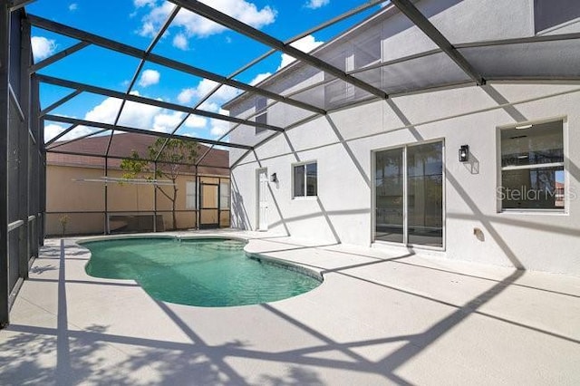 227 Sand Ridge Dr, Davenport, FL 33896 - outdoor pool with glass enclosure and a patio