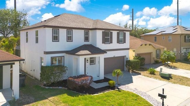 227 Sand Ridge Dr, Davenport, FL 33896 - view of front facade featuring a front lawn, an attached garage, concrete driveway, and stucco siding