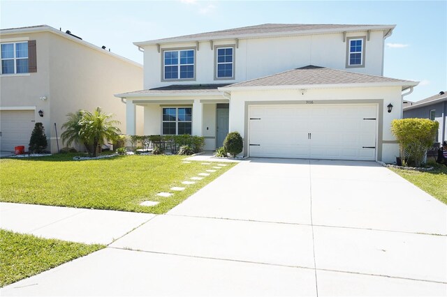 9016 Pyrus St, Kissimmee, FL 34747 - traditional home with stucco siding, concrete driveway, a front lawn, a garage, and roof with shingles