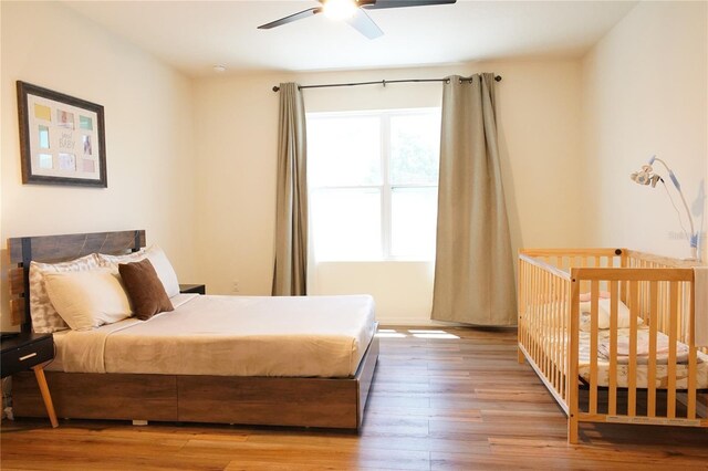 9016 Pyrus St, Kissimmee, FL 34747 - bedroom with hardwood / wood-style flooring and ceiling fan