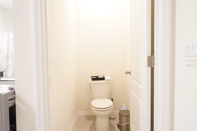 9016 Pyrus St, Kissimmee, FL 34747 - bathroom with toilet and tile patterned flooring