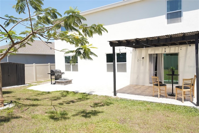 9016 Pyrus St, Kissimmee, FL 34747 - back of property with a patio area, stucco siding, and a pergola