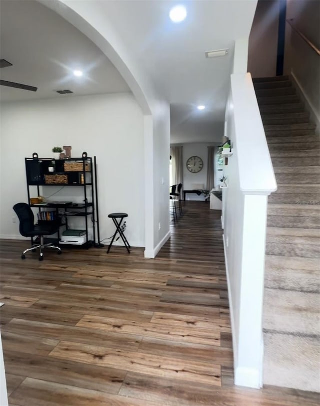9016 Pyrus St, Kissimmee, FL 34747 - corridor with arched walkways, wood finished floors, recessed lighting, baseboards, and an office area